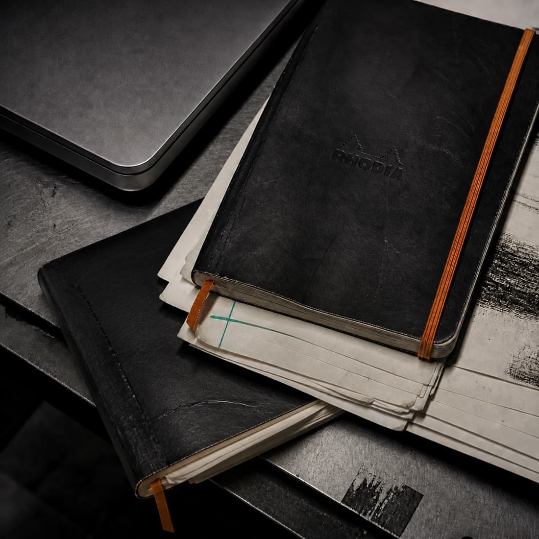 Generated still life of used Rhodia notebooks