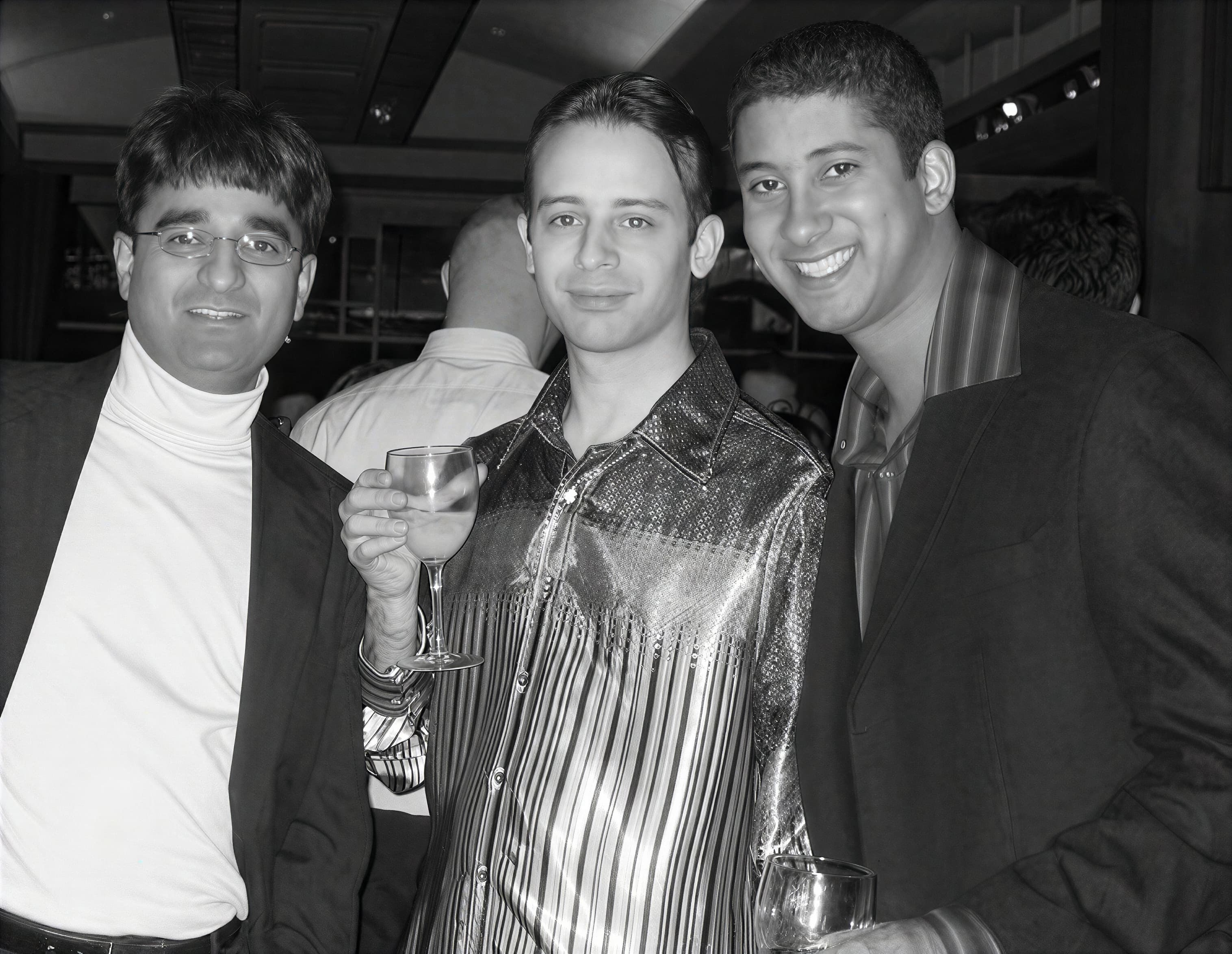 Shane, at center, with two people during his Vonage years.